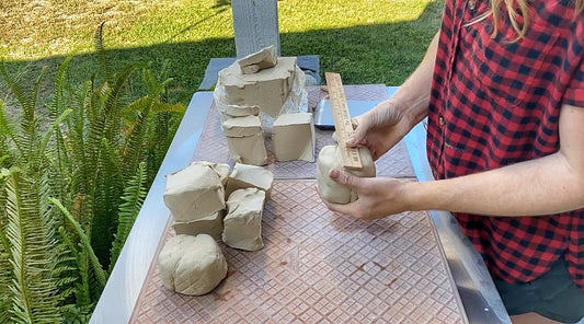 Cheer preparing clay for her functional pottery shop update for Dirtbag Ceramics.